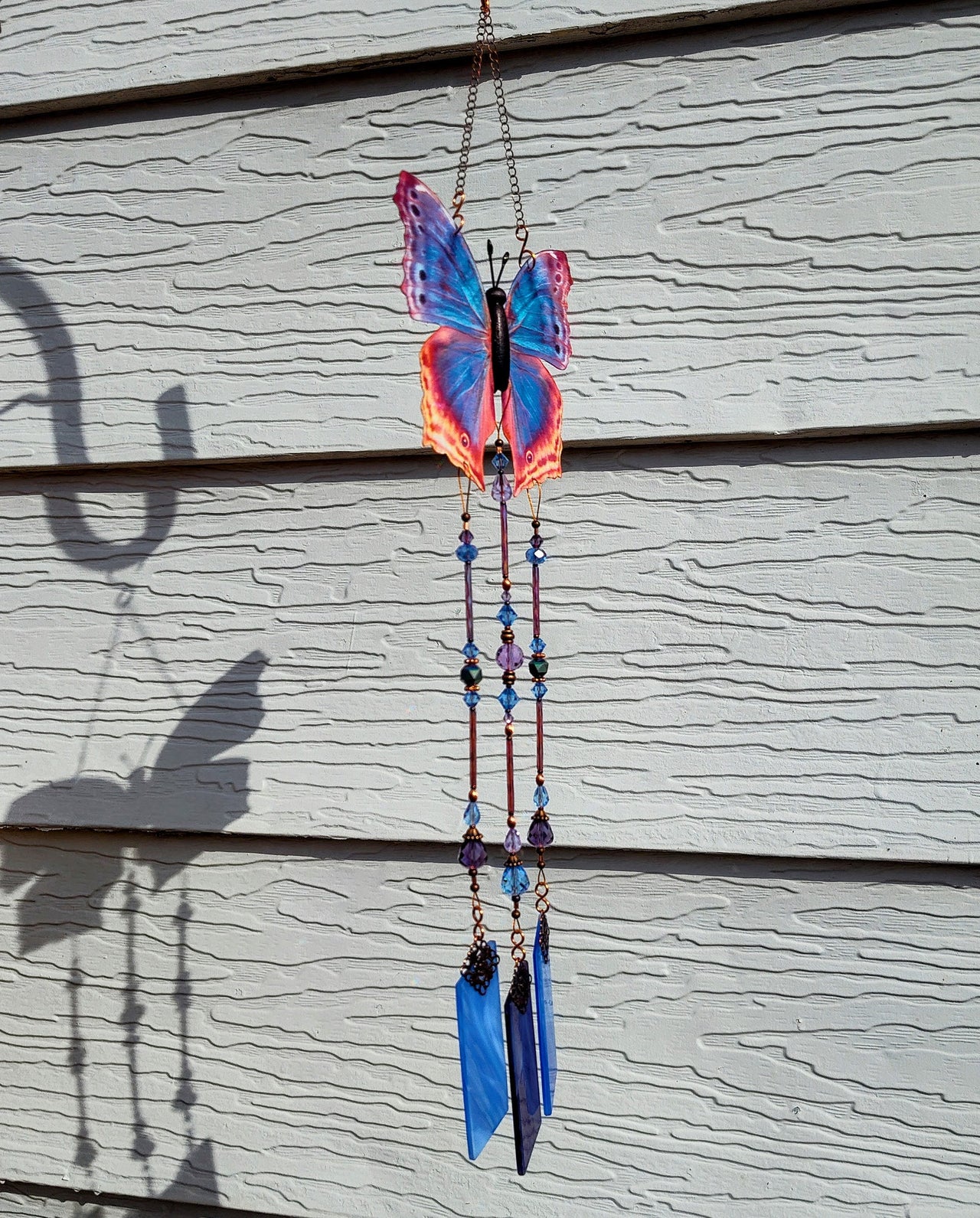 Eastern Blue Beauty stained glass and crystal wind chimes brockus creations 2 also known as blue mother-of-pearl butterfly handcrafted in the USA blue and purple crystal with copper accents home decor, garden decor, garden art, gift for mom or dad