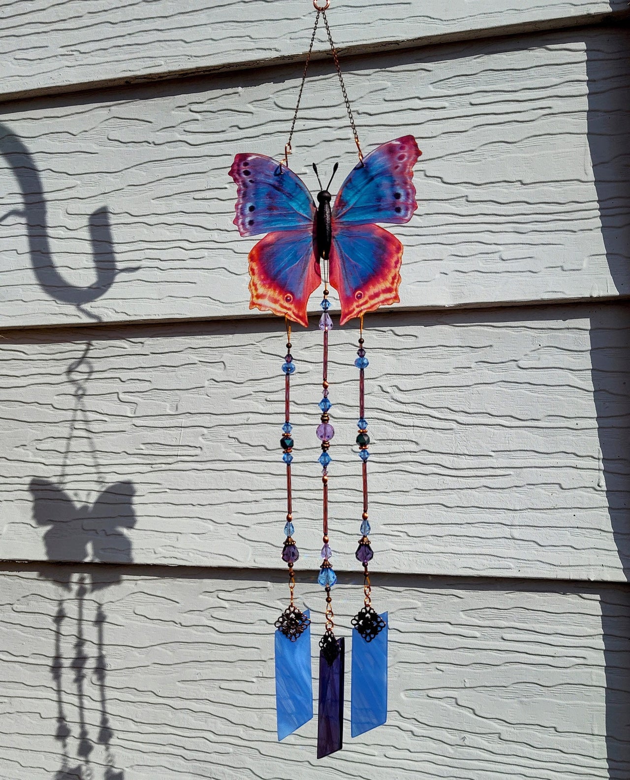 Eastern Blue Beauty stained glass and crystal wind chimes brockus creations 1 also known as blue mother-of-pearl butterfly handcrafted in the USA blue and purple crystal with copper accents home decor, garden art, memorial and sympathy gift