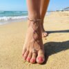 Silver, pink and black ankle bracelet barefoot sandal on woman's foot at beach handcrafted by brockus creations